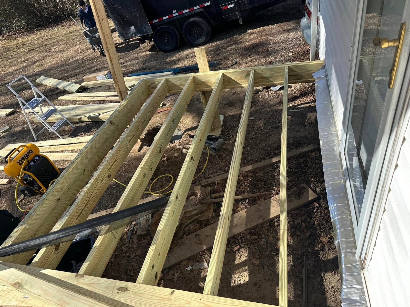 Composite decking boards being installed
